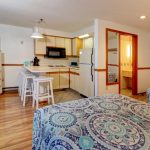 Two Beds And View Of Kitchen